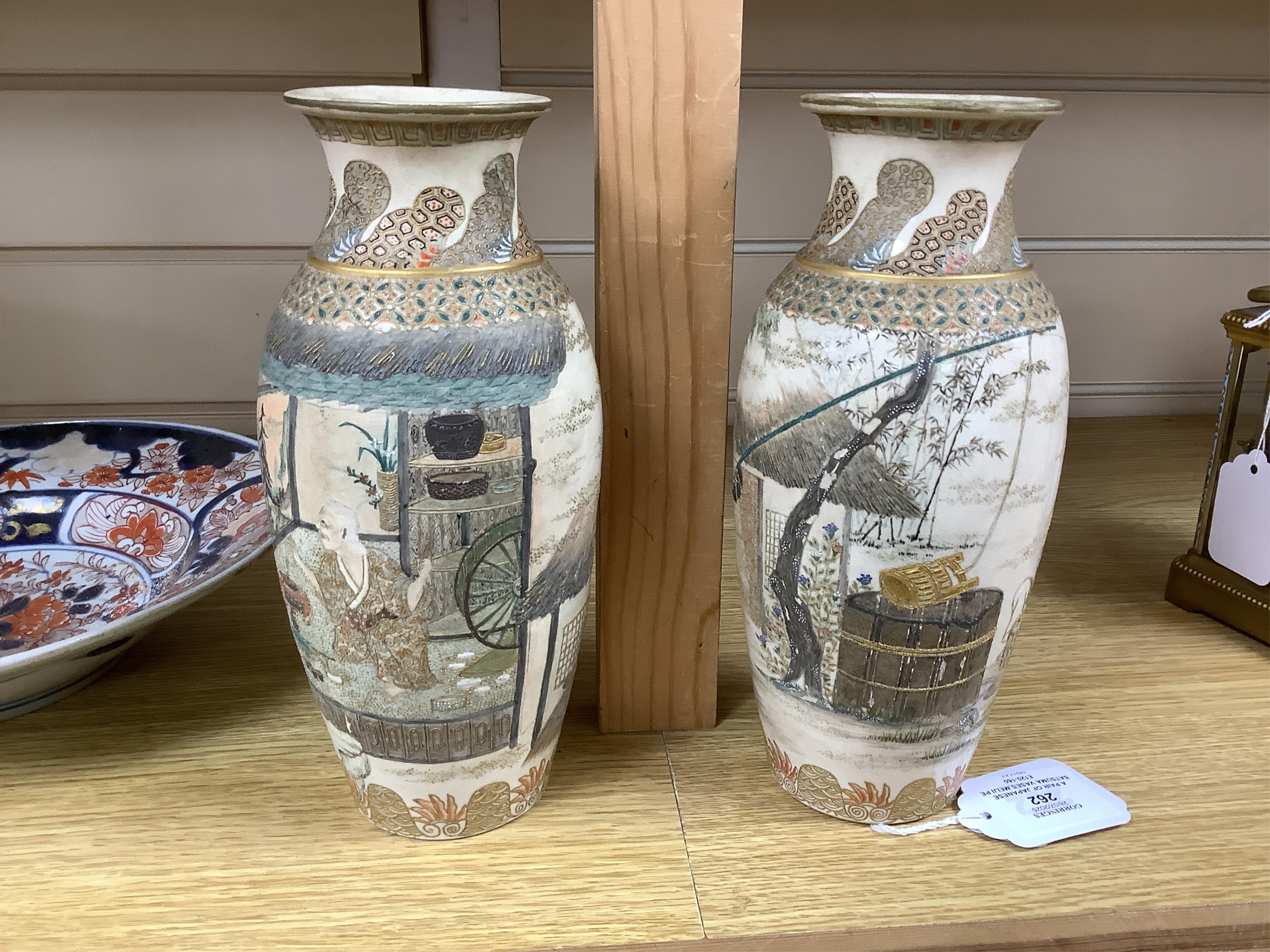 A pair of Japanese Satsuma vases,Meiji period, signed, 23cm